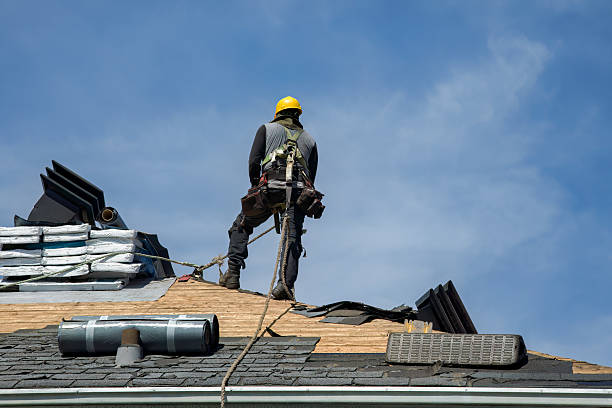 Professional Roofing technician working in Aston, PA